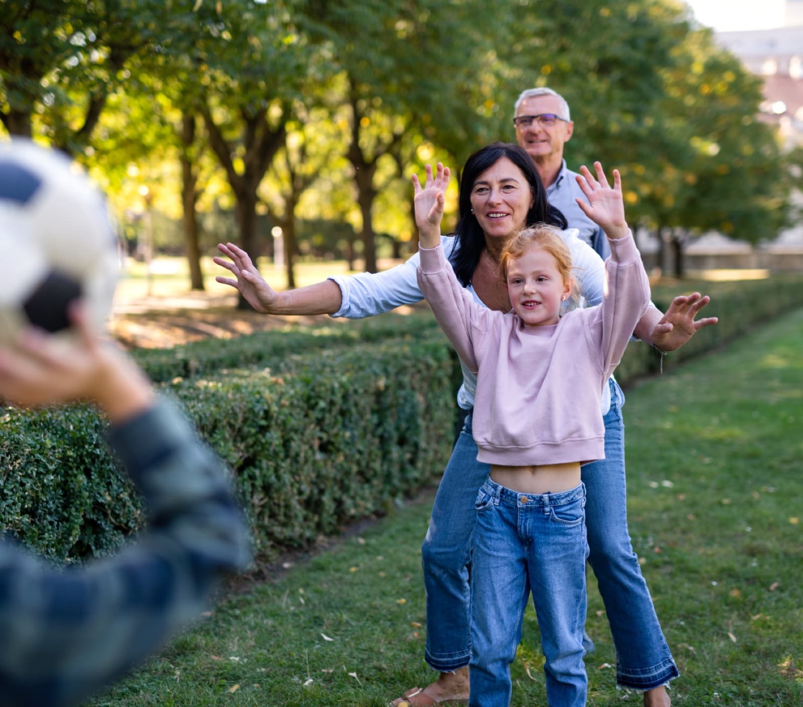 Three generations of a family playing in the park